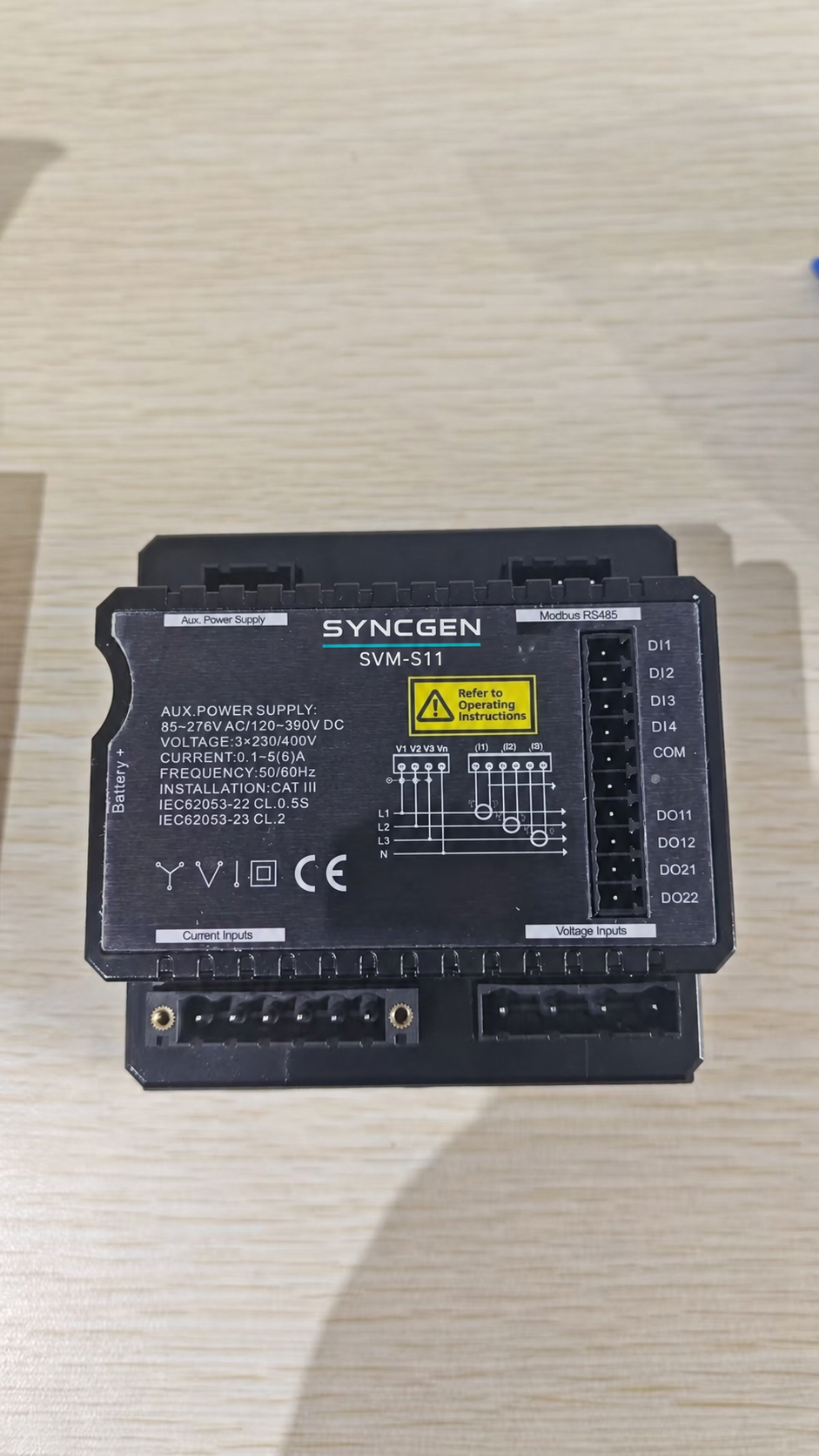 Rear view of SYNCGEN SVM-S11 power analyzer showing Modbus RS485, digital I/O, voltage inputs and current inputs